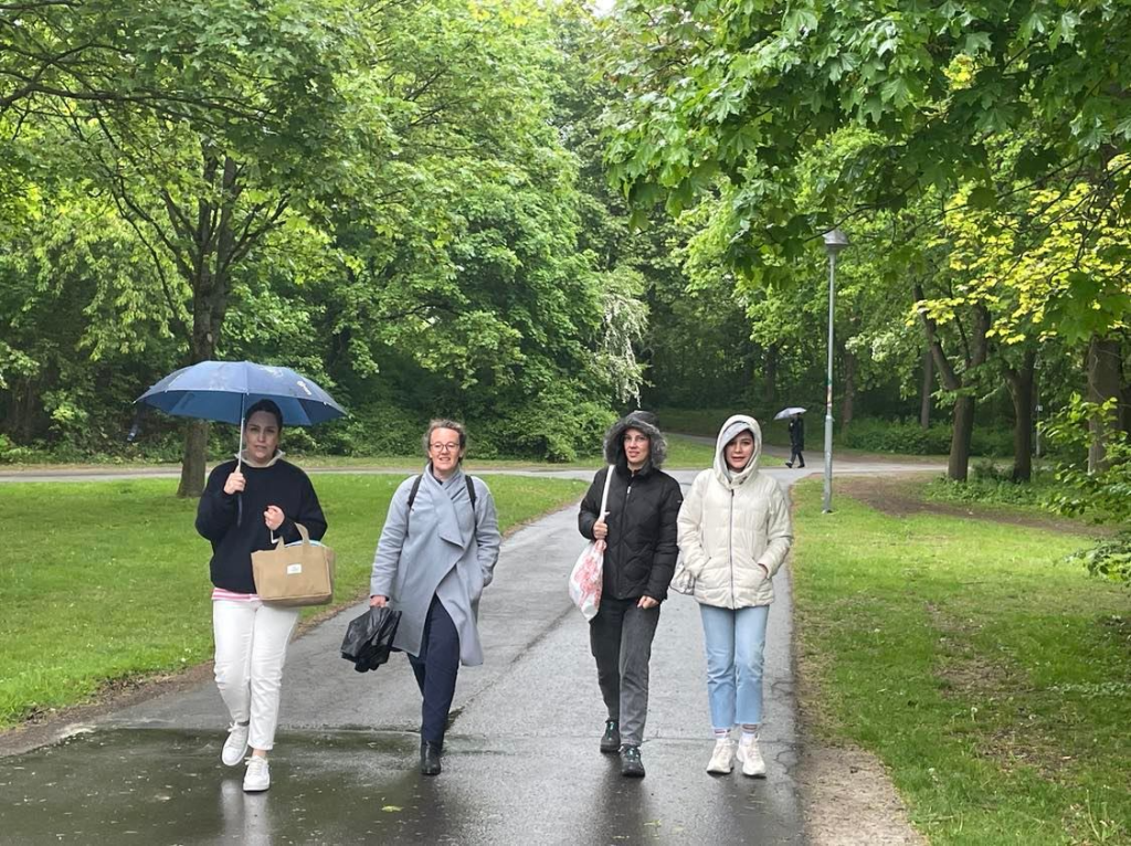 Four women walking in the rain. 